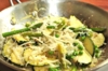 [Image: Padella; Asparagi, zucchini, piselli e caricofi saltati con uova, Parmigiano Reggiano, prezzemolo e aglio]
